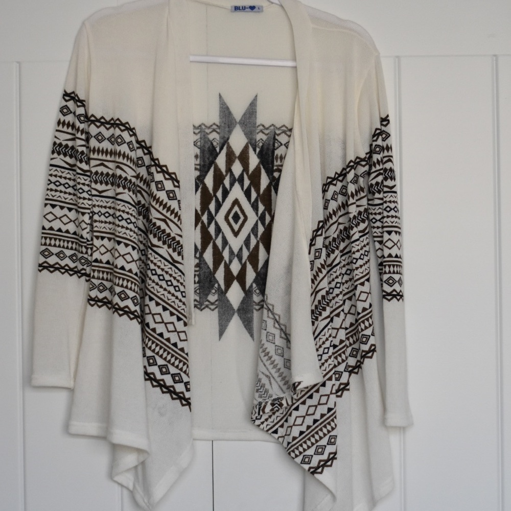 White cardigan with black and brown Aztec print
